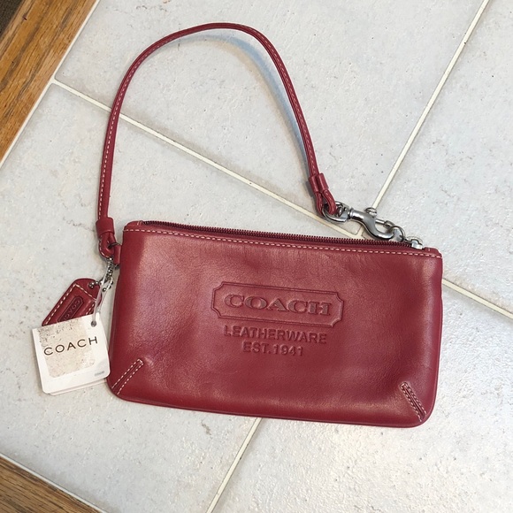 Coach Handbags - Coach Red Leather Wristlet with Embossed Logo